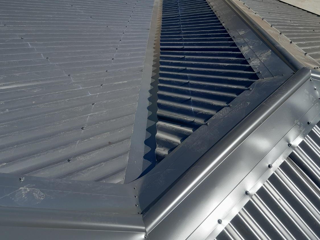 Hip and ridge capping cut clean on a new-build roof